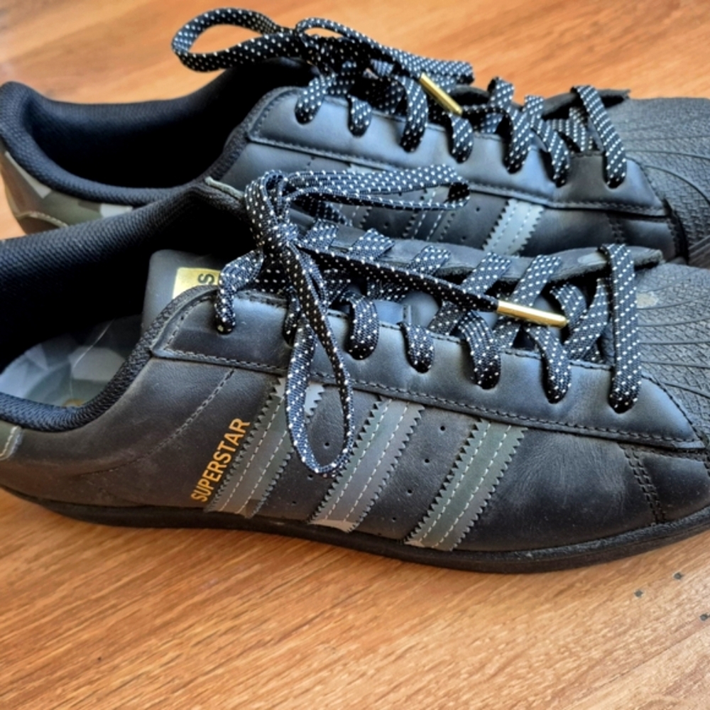 Adidas Black and Gold Sneakers with Iconic Design